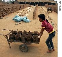 Young girl works at a brick kiln at Liuwu Village in China's Shanxi province